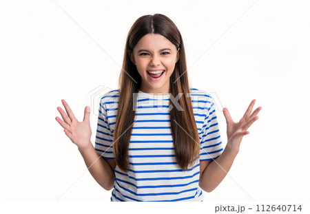 angry teen girl isolated on white background. portrait of angry teen girl in tshirt. angry teen girl isolated on white background. portrait of angry teen girl in tshirt. 112640714