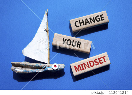 Change your mindset symbol. Concept words Change your mindset on wooden blocks. Beautiful blue background with boat. Business and Change your mindset concept. Copy space. Change your mindset symbol. Concept words Change your mindset on wooden blocks. Beautiful blue background with boat. Business and Change your mindset concept. Copy space. 112641214