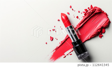 Vibrant red matte lipstick with glossy finish on white background for bold makeup look. 112641345