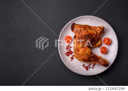 Delicious grilled chicken leg or quarter with salt and spices Delicious grilled chicken leg or quarter with salt and spices 112642396
