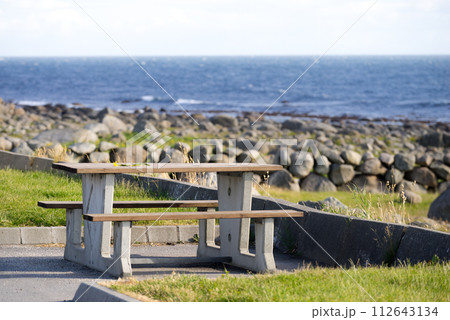 Rest stop area picnic site on sea shore 112643134
