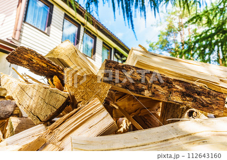 Stack of firewood at house Stack of firewood at house 112643160