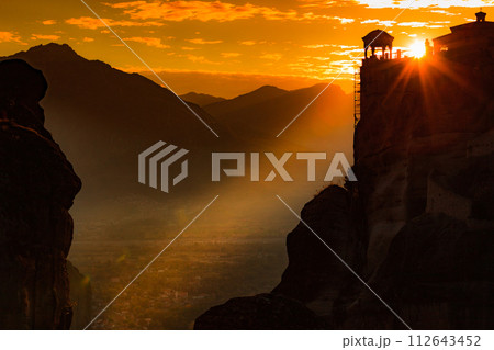 Sunset over Varlaam monastery in Meteora, Greece Sunset over Varlaam monastery in Meteora, Greece 112643452