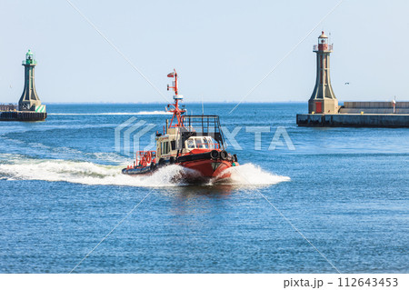 Small vessel returning to port. 112643453