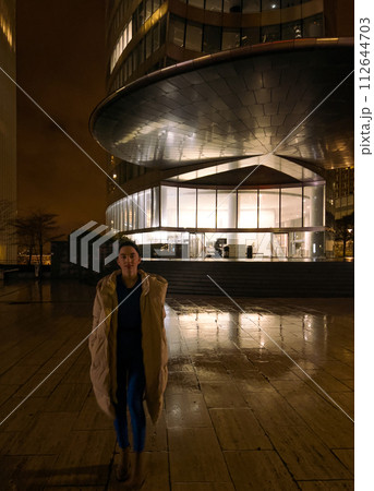 Beautiful young woman tourist in Paris at night. Paris is the capital and most populous city of France. 112644703