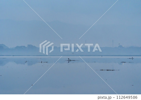 Reflection of lake with sunset sky. Nature landscape background. 112649586