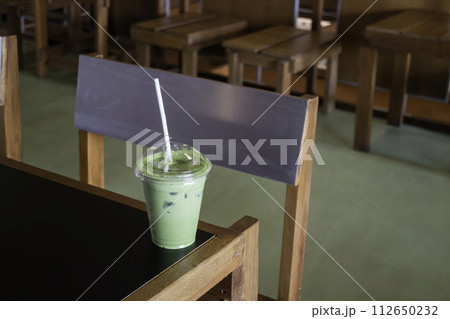Matcha latte or iced green tea 112650232