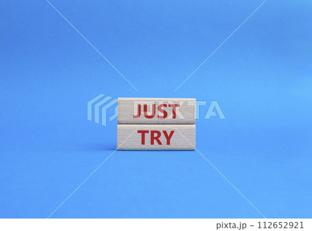 Just try symbol. Concept words Just try on wooden blocks. Beautiful blue background. Business and Just Try concept. Copy space. Just try symbol. Concept words Just try on wooden blocks. Beautiful blue background. Business and Just Try concept. Copy space. 112652921