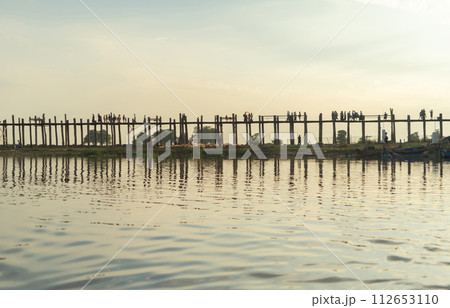 U Bein Bridge with lake, Wooden Bridge in Mon village, Myanmar or Burma, Asia. 112653110