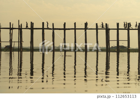 U Bein Bridge with lake, Wooden Bridge in Mon village, Myanmar or Burma, Asia. 112653113