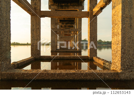 U Bein Bridge with lake, Wooden Bridge in Mon village, Myanmar or Burma, Asia. U Bein Bridge with lake, Wooden Bridge in Mon village, Myanmar or Burma, Asia. 112653143