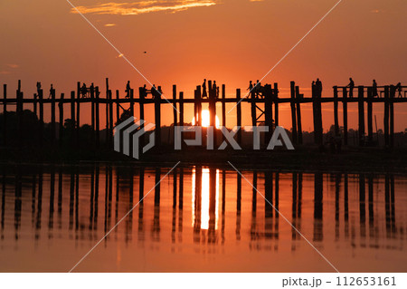 U Bein Bridge with lake, Wooden Bridge in Mon village, Myanmar or Burma, Asia. 112653161