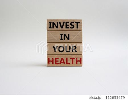 Invest in your Health symbol. Concept words Invest in your Health on wooden blocks. Beautiful white background. Business and Invest in your Health concept. Copy space. Invest in your Health symbol. Concept words Invest in your Health on wooden blocks. Beautiful white background. Business and Invest in your Health concept. Copy space. 112653479