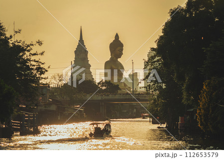 The Giant Golden Buddha in Wat Paknam Phasi Charoen Temple in Phasi Charoen district, Bangkok urban city, Thailand. The Giant Golden Buddha in Wat Paknam Phasi Charoen Temple in Phasi Charoen district, Bangkok urban city, Thailand. 112653579