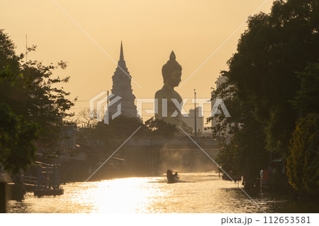 The Giant Golden Buddha in Wat Paknam Phasi Charoen Temple in Phasi Charoen district, Bangkok urban city, Thailand. 112653581
