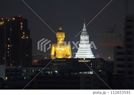 The Giant Golden Buddha in Wat Paknam Phasi Charoen Temple in Phasi Charoen district, Bangkok urban city, Thailand. The Giant Golden Buddha in Wat Paknam Phasi Charoen Temple in Phasi Charoen district, Bangkok urban city, Thailand. 112653591