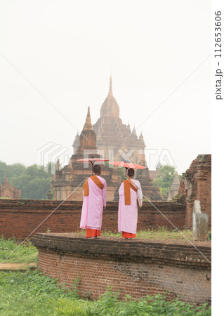 A monk in Burmese temples of Bagan City, Myanmar or Burma. People lifestyle. A monk in Burmese temples of Bagan City, Myanmar or Burma. People lifestyle. 112653606