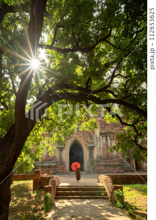 A monk in Burmese temples of Bagan City, Myanmar or Burma. People lifestyle. 112653625
