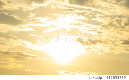 Sunset sky. Abstract nature background. Dramatic blue with orange colorful clouds in twilight time. 112653789