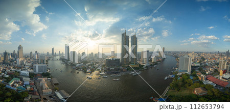 Aerial view of boats and Taksin Bridge with Chao Phraya River, Bangkok Downtown. Thailand. Financial district and business centers in smart urban city. Skyscraper and high-rise buildings. Aerial view of boats and Taksin Bridge with Chao Phraya River, Bangkok Downtown. Thailand. Financial district and business centers in smart urban city. Skyscraper and high-rise buildings. 112653794