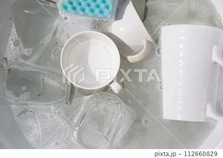 Washing used drinking glasses and cups Washing used drinking glasses and cups 112660829
