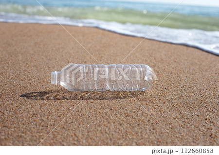 Plastic bottle on the beach Plastic bottle on the beach 112660858
