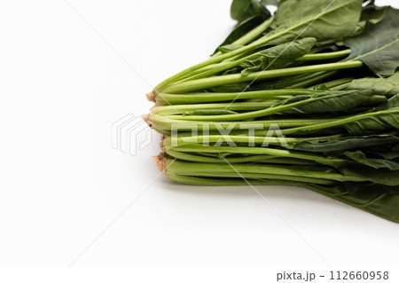 Fresh spinach on white background Fresh spinach on white background 112660958