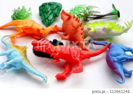 Plastic dinosaur toys on white background. Plastic dinosaur toys on white background. 112661248