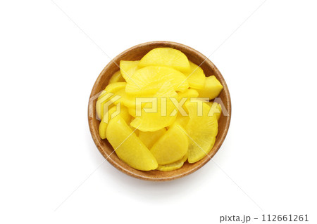 Sweet and tart slices of yellow pickled daikon, known as takuan in Japan and danmuji in Korea. 112661261