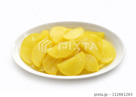 Sweet and tart slices of yellow pickled daikon, known as takuan in Japan and danmuji in Korea. 112661263