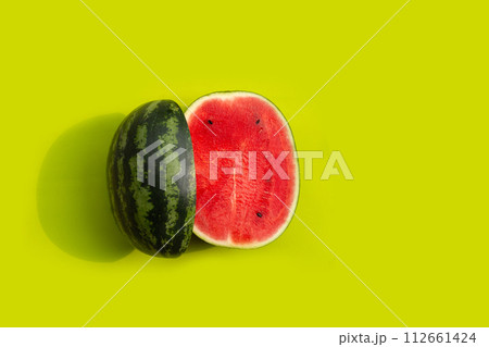Fresh watermelon on green background. 112661424