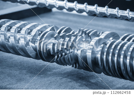 Close up scene group of the barrel screw of injection machine spare parts. Close up scene group of the barrel screw of injection machine spare parts. 112662458