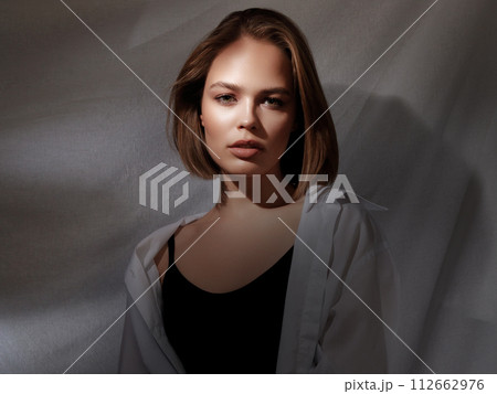 Portrait of beautiful young brunette woman with Portrait of beautiful young brunette woman with 112662976