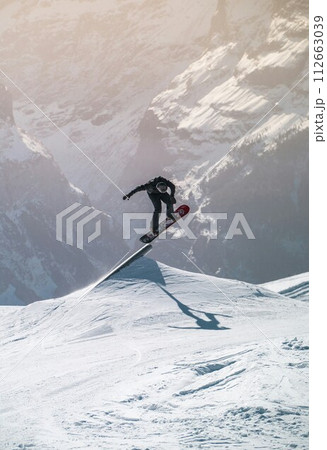 snowboarder jumping 112663039