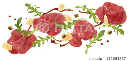 Falling beef carpaccio ingredients, arugula, parmesan cheese and balsamic sauce splash isolated on white background with clipping path Falling beef carpaccio ingredients, arugula, parmesan cheese and balsamic sauce splash isolated on white background with clipping path 112665287