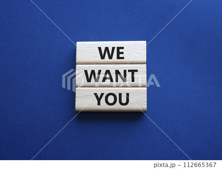 We want you symbol. Concept words We want you on wooden blocks. Beautiful deep blue background. Business and We want you concept. Copy space. 112665367
