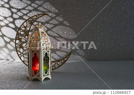 Ramadan Kareem. golden moon and lantern on glowing background for Holy month Ramadan celebration Ramadan Kareem. golden moon and lantern on glowing background for Holy month Ramadan celebration 112666927