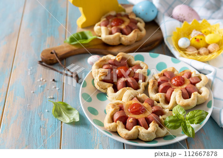 Pizza in puff pastry with cheese and tomatoes. Pizza in puff pastry with cheese and tomatoes. 112667878