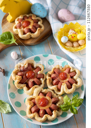 Pizza in puff pastry with cheese and tomatoes. Pizza in puff pastry with cheese and tomatoes. 112667880