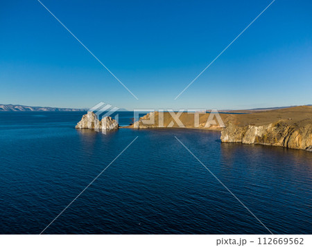 Shamanka Rock. Lake Baikal at Olkhon Island. the village of Khuzhir Shamanka Rock. Lake Baikal at Olkhon Island. the village of Khuzhir 112669562