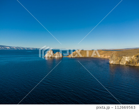 Shamanka Rock. Lake Baikal at Olkhon Island. the village of Khuzhir Shamanka Rock. Lake Baikal at Olkhon Island. the village of Khuzhir 112669563