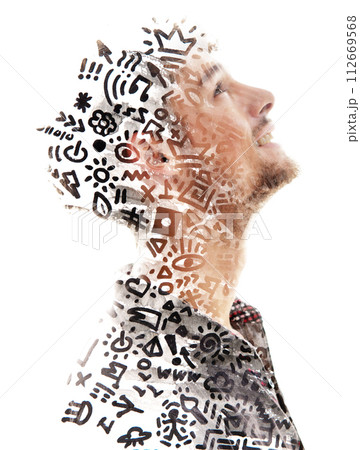 A double exposure paintography of a man's profile merged with doodles 112669568