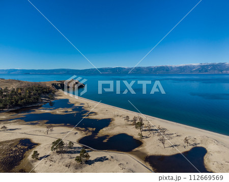 Sarayskiy beach. Shamanka Rock. Lake Baikal at Olkhon Island. the village of Khuzhir 112669569