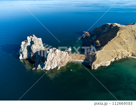 Sarayskiy beach. Shamanka Rock. Lake Baikal at Olkhon Island. the village of Khuzhir Sarayskiy beach. Shamanka Rock. Lake Baikal at Olkhon Island. the village of Khuzhir 112669583