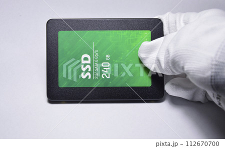 Close-up photo of 2.5" SSD hard drive, empty on white background. 112670700