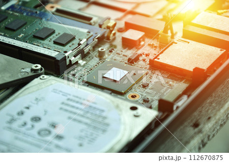 Close-up of a part of a computer motherboard, with many IC chips visible. Close-up of a part of a computer motherboard, with many IC chips visible. 112670875