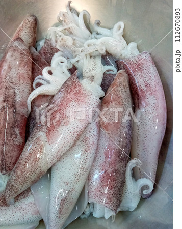 Fresh squid prepared for cooking 112670893