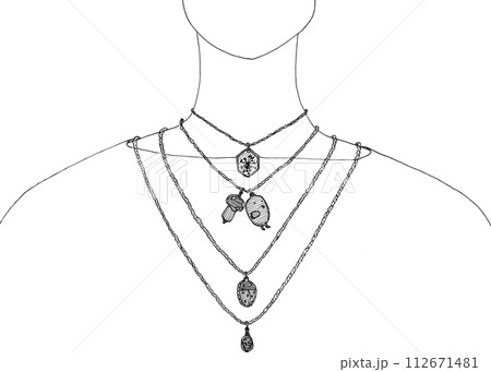 different pendants on chains on a woman's neck 112671481