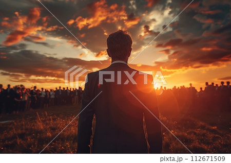 AI-generated content. Back view of man facing sunset crowd 112671509