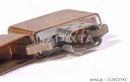 Used vintage metal lighter isolated on white background 112672542